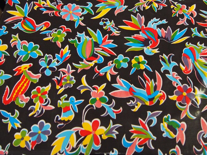 Black oil cloth with animal patterns