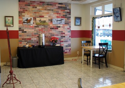 The self serve coffee area is to the right as you come in the door near the reading nook.